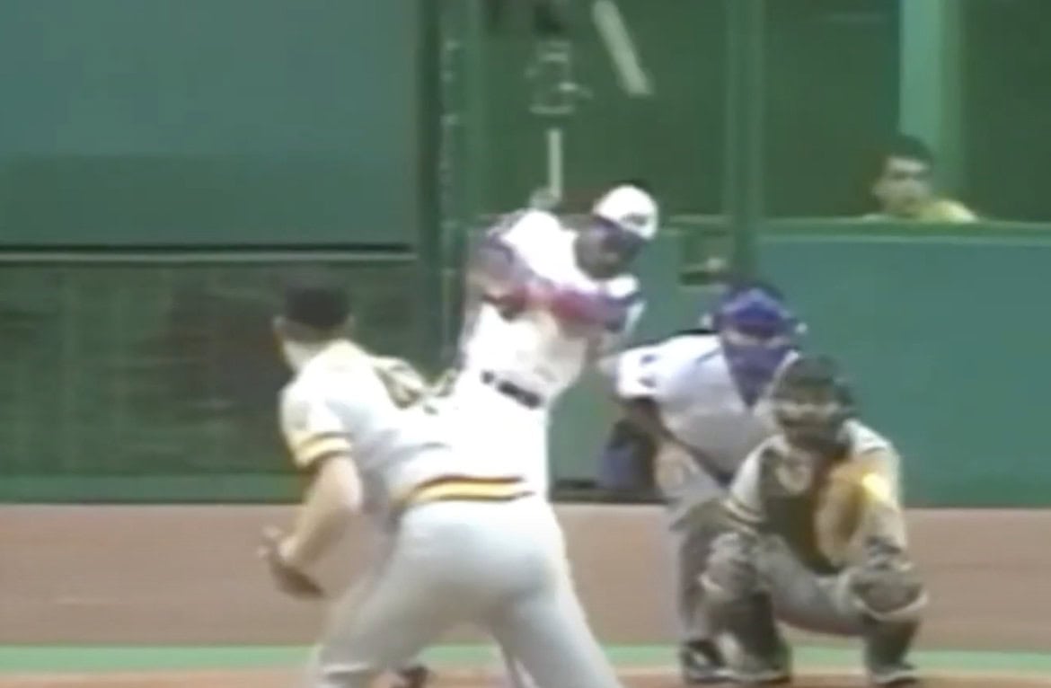 Tim Raines, a legendary switch hitter, showcasing his speed and precision in action.